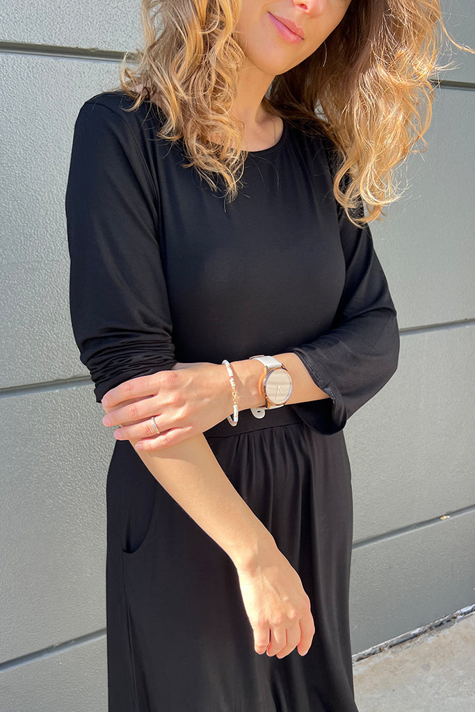 Close up of black bamboo dress with 3/4 length sleeves
