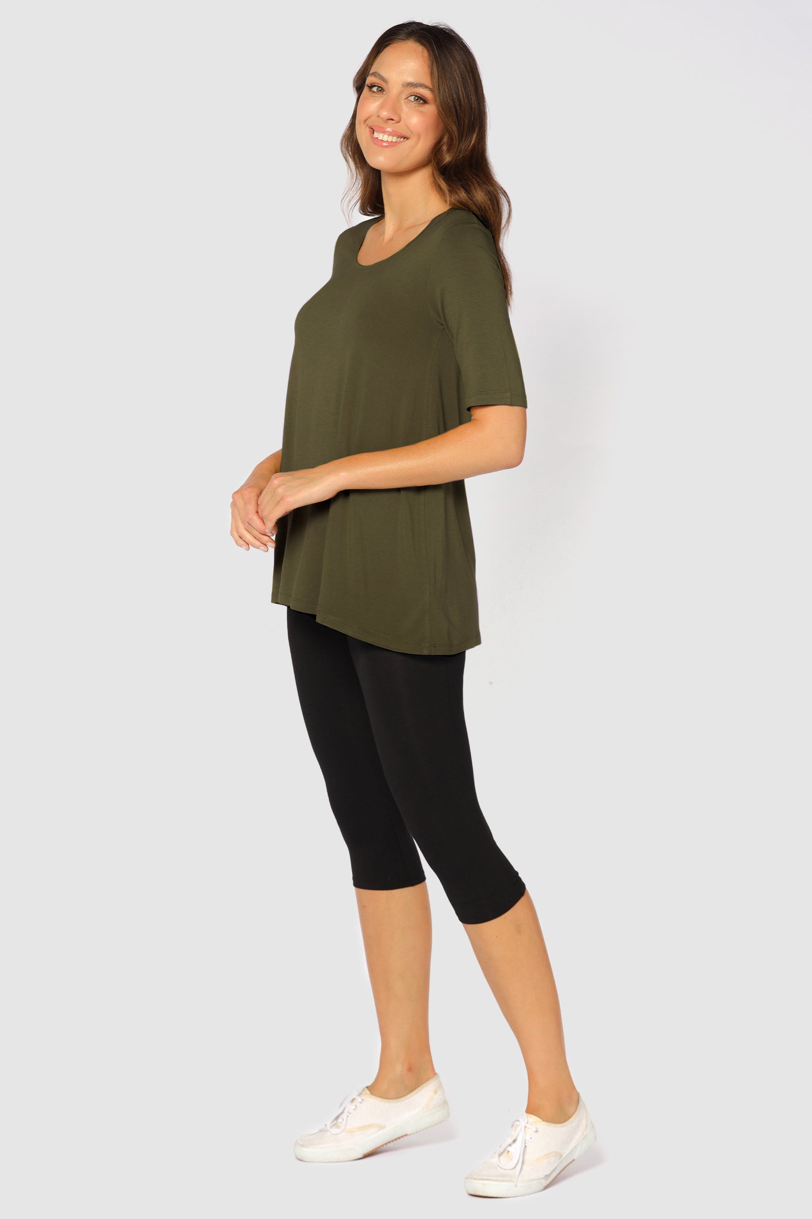 a side view of the 3/4 soft bamboo leggings in black