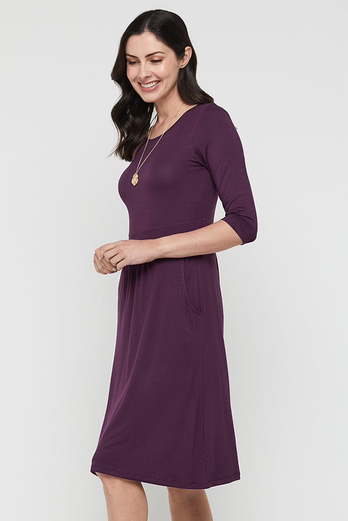 Side view of purple bamboo dress with round neckline and an inbuilt waistband.