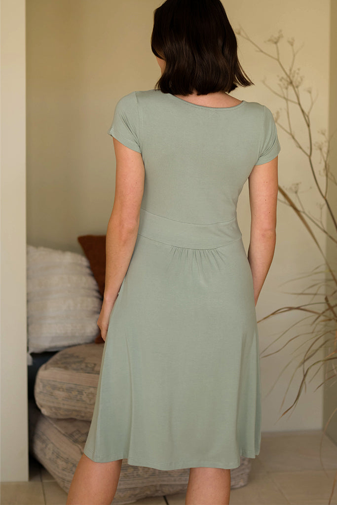 Back view of knee-length green dress