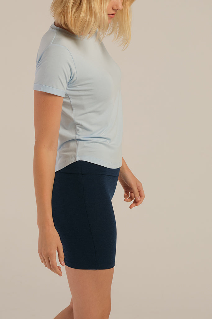 a side view of the dark navy bike shorts