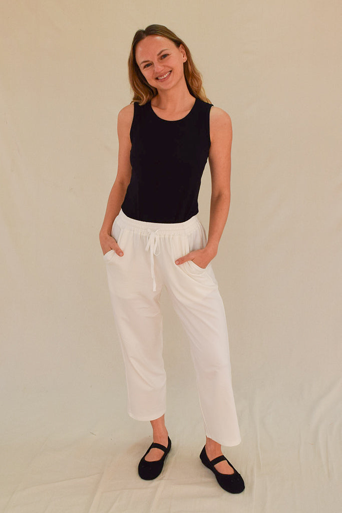 Sleeveless black bamboo top with a high neckline