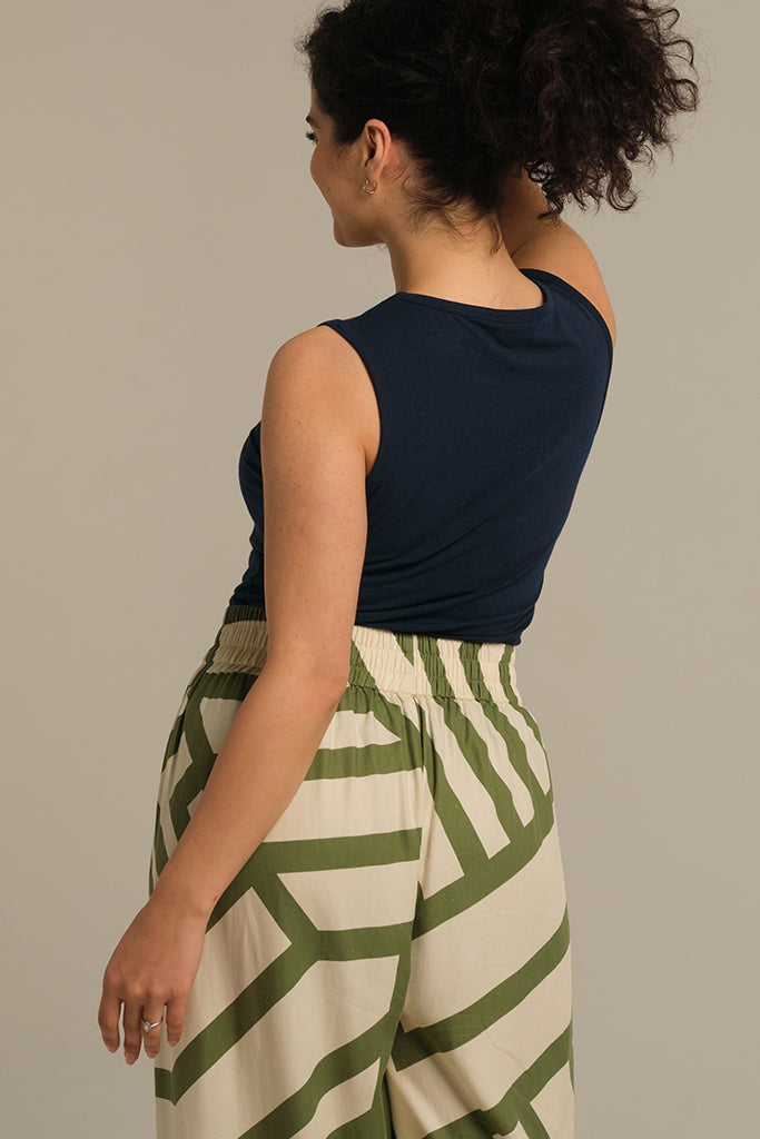 Back view of a dark navy blue tank top with wide shoulder straps