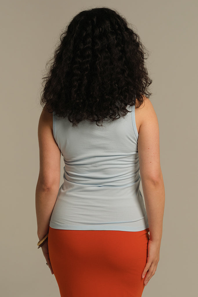 Back view of light blue tank top hip length.
