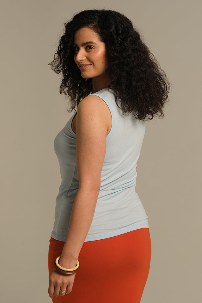 Light blue singlet with scoop neck and snug fit