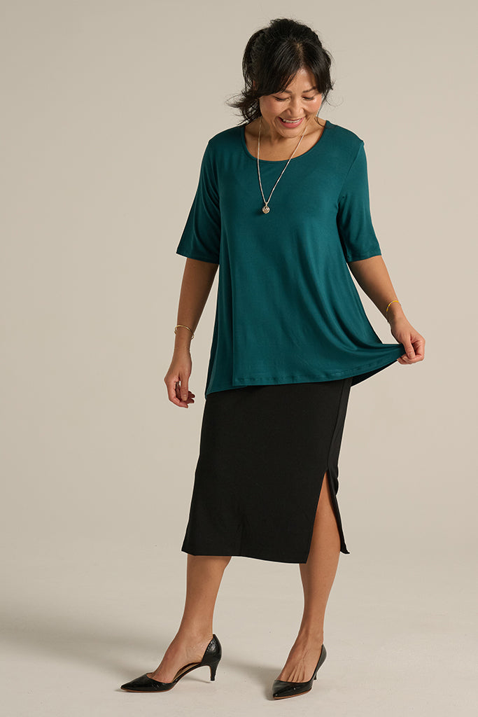 office wear outfit with black skirt and green top
