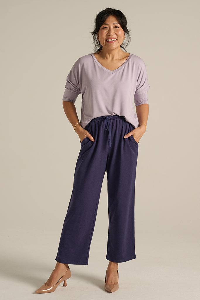 Straight leg indigo blue pants with an elastic waistband with drawstring and side pockets