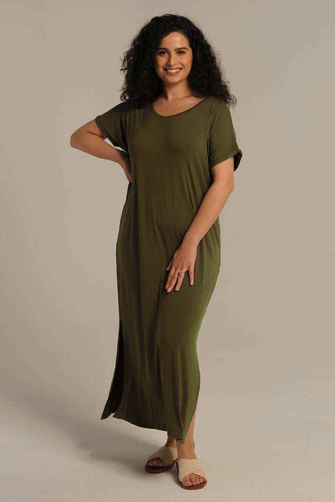 Dark olive bamboo maxi dress styled on model with short rolled-hem sleeves and relaxed fit