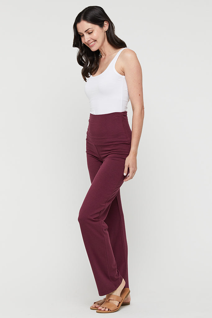 Side view of burgundy bamboo pants showing natural drape and fit