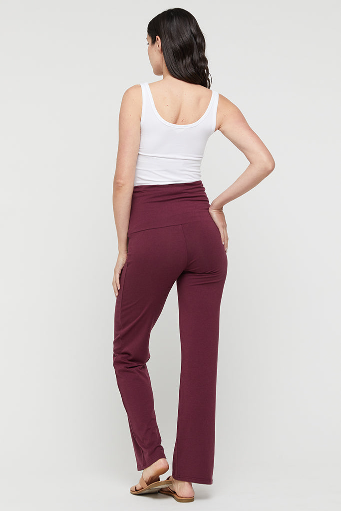 Back view of burgundy bamboo pants highlighting smooth cut and long length