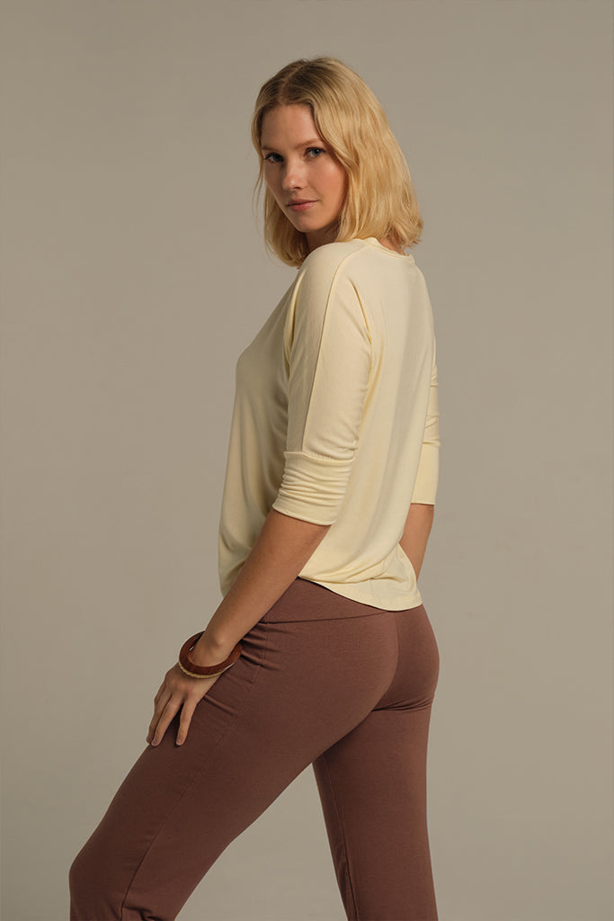 Rear view of light brown bamboo yoga pants with flattering fit