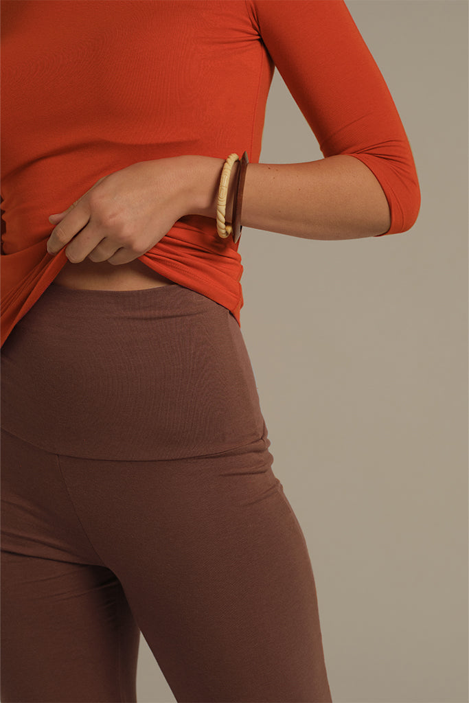 Close-up of mocha-toned bamboo fabric with breathable texture and gentle stretch