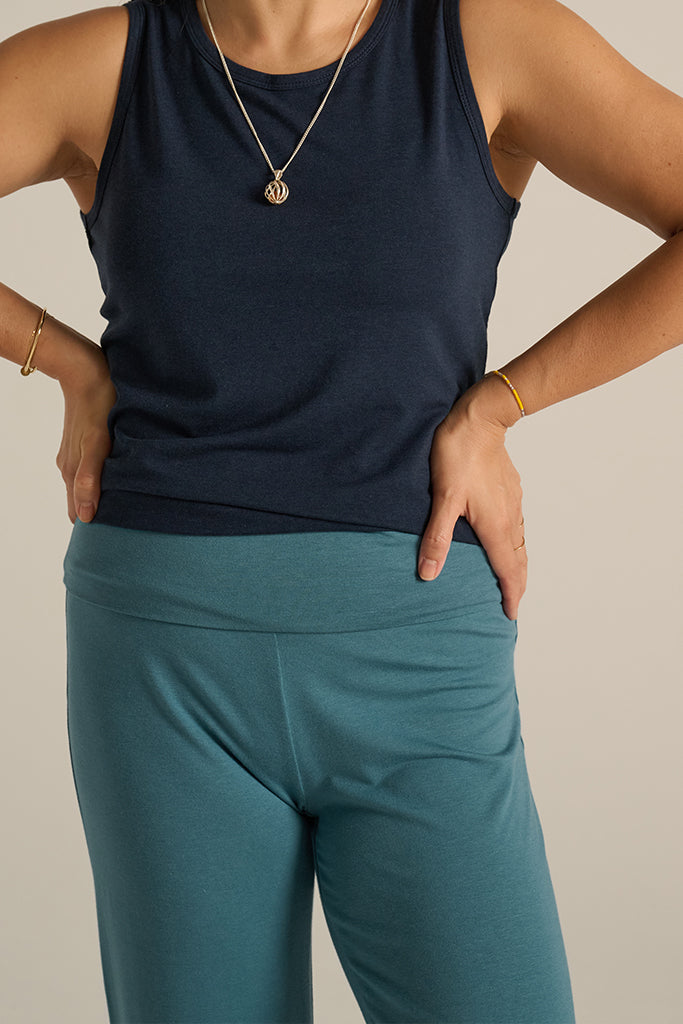 Breathable bamboo yoga pants in ocean shade featuring a fold-over waistband