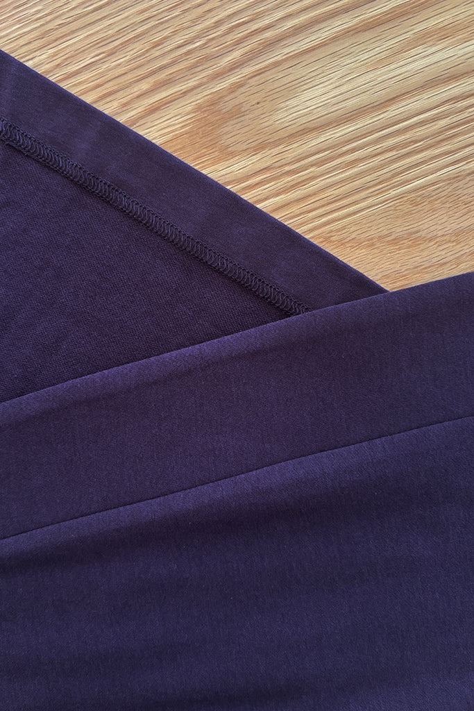 Close up of indigo bamboo fabric on a wooden surface