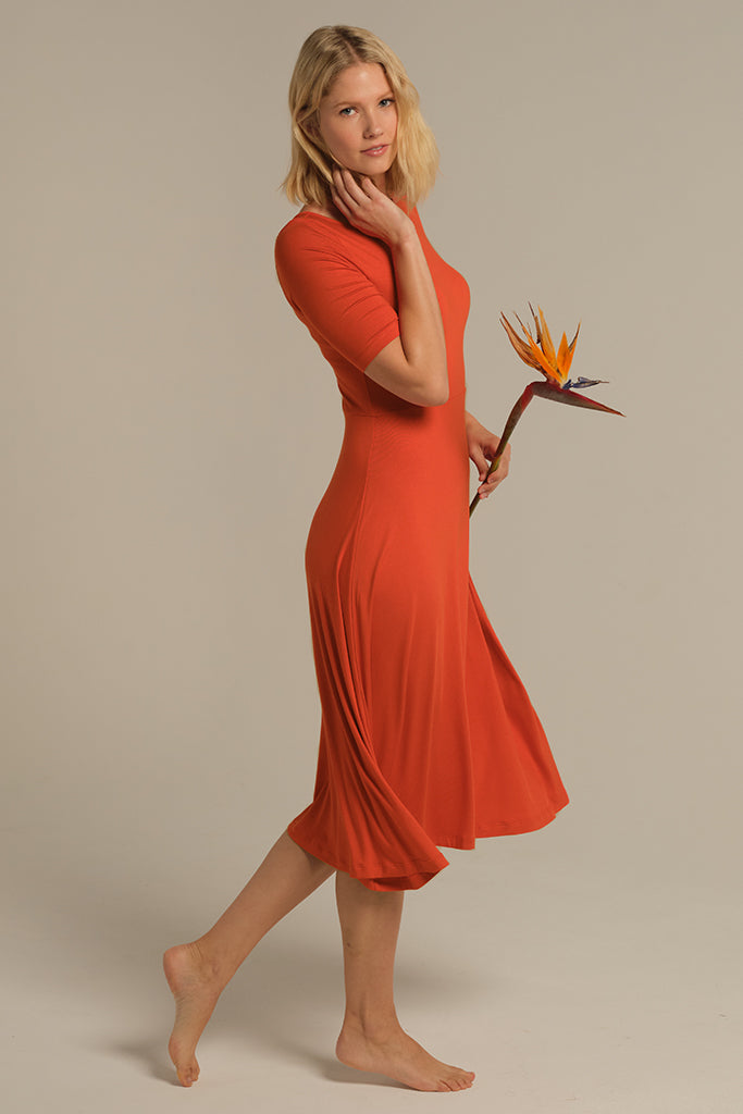 Lightweight and versatile bamboo dress in orange.