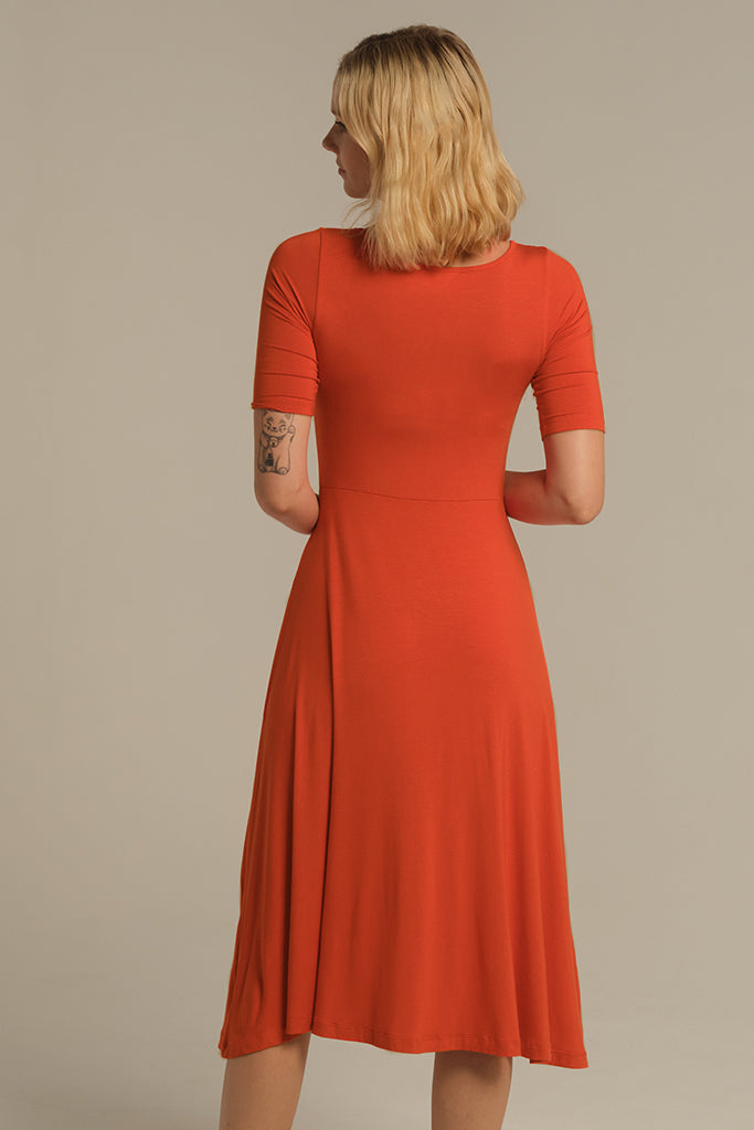 Back view of bamboo midi dress with floaty skirt.