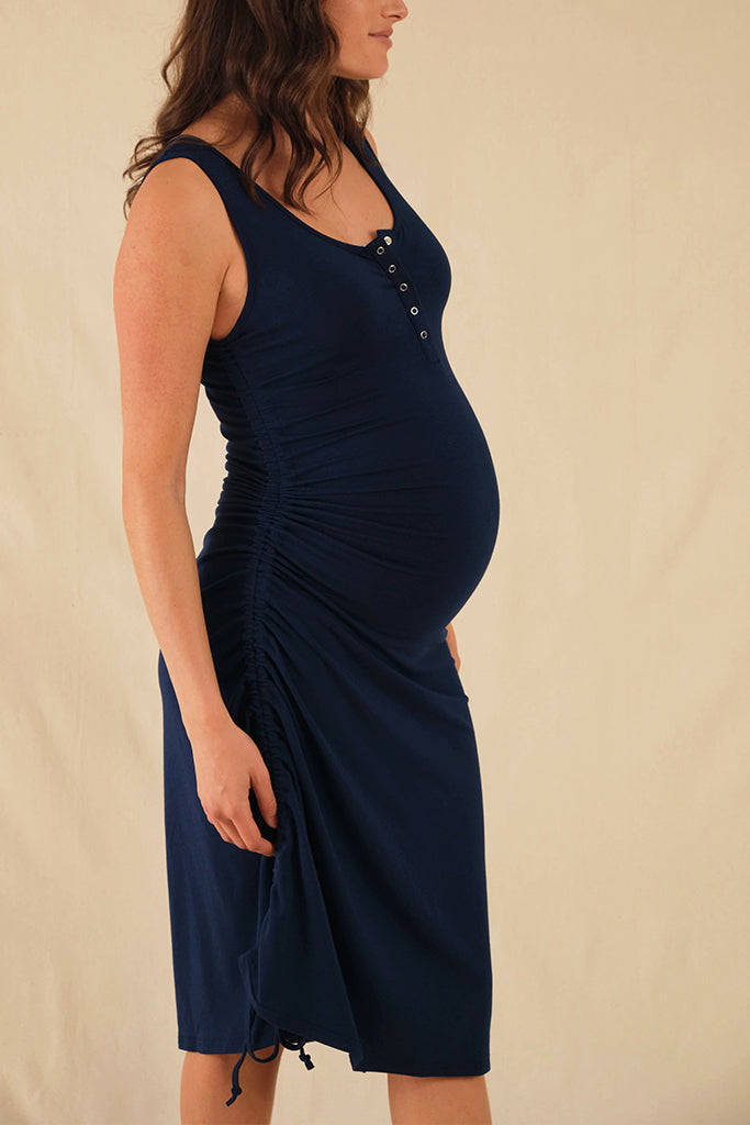 Navy sleeveless Henley dress made from sustainable bamboo, styled for maternity wear.
