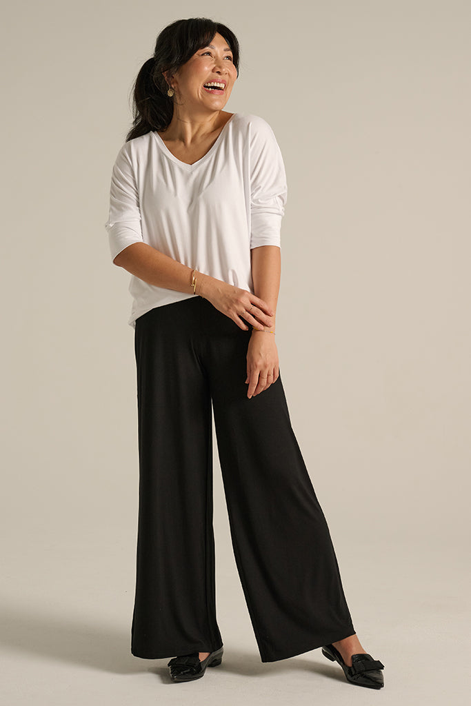 a woman wearing wide leg bamboo Luxe pants with comfy stretchy waistband