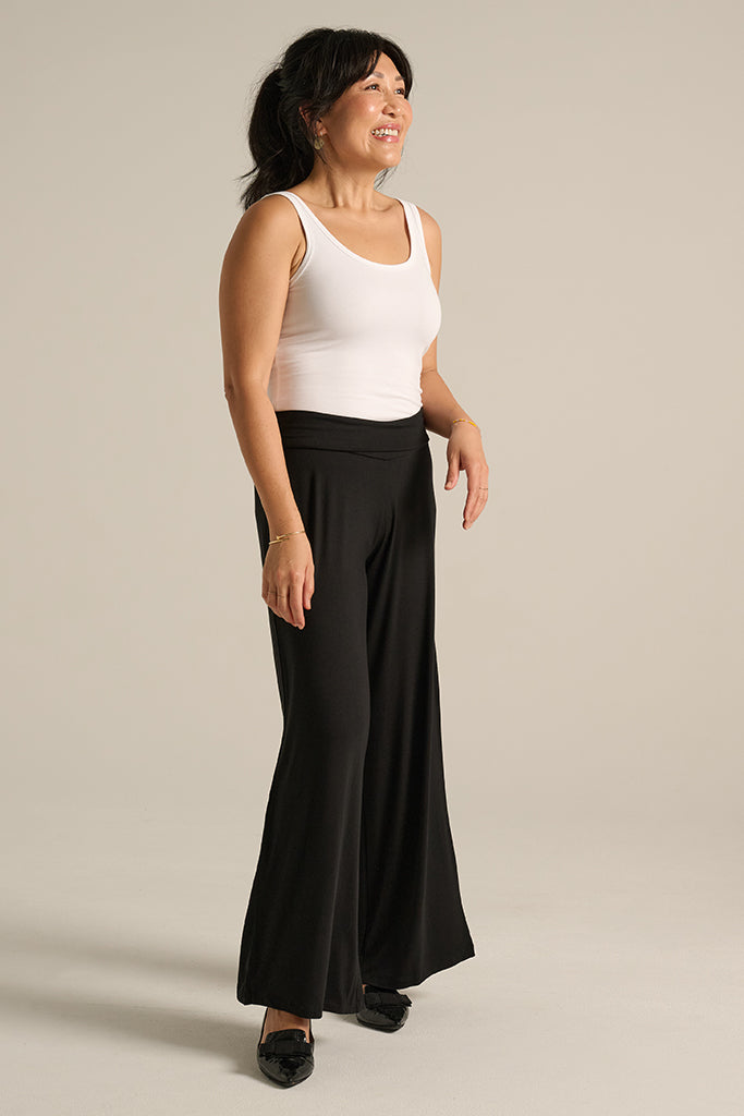 a model wearing the bamboo luxe wide leg pants in a petite length
