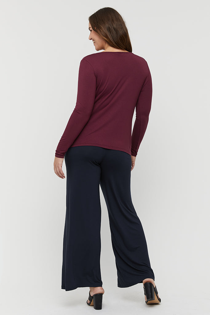 back view of the wide leg dark navy pants paired with high heels