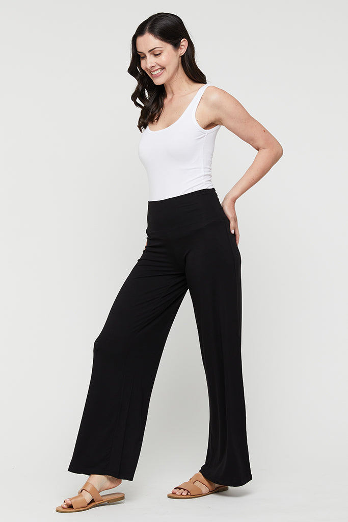 a model wearing bamboo wide leg Luxe pants with wide stretchy waistband