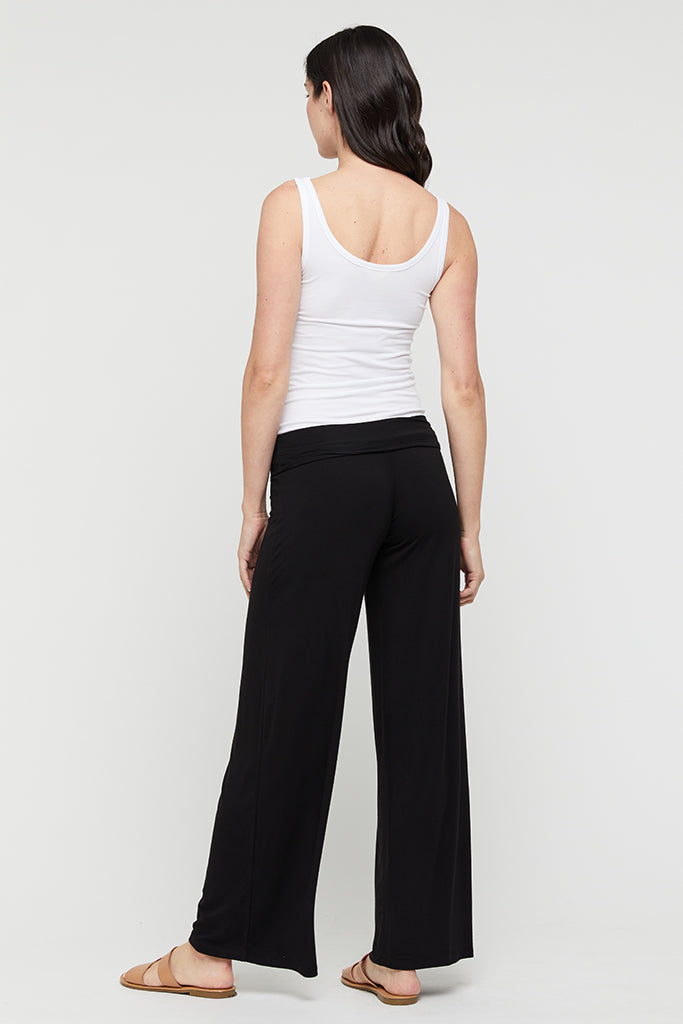 a back view of the luxe wide leg pants in black with soft stretchy waistband