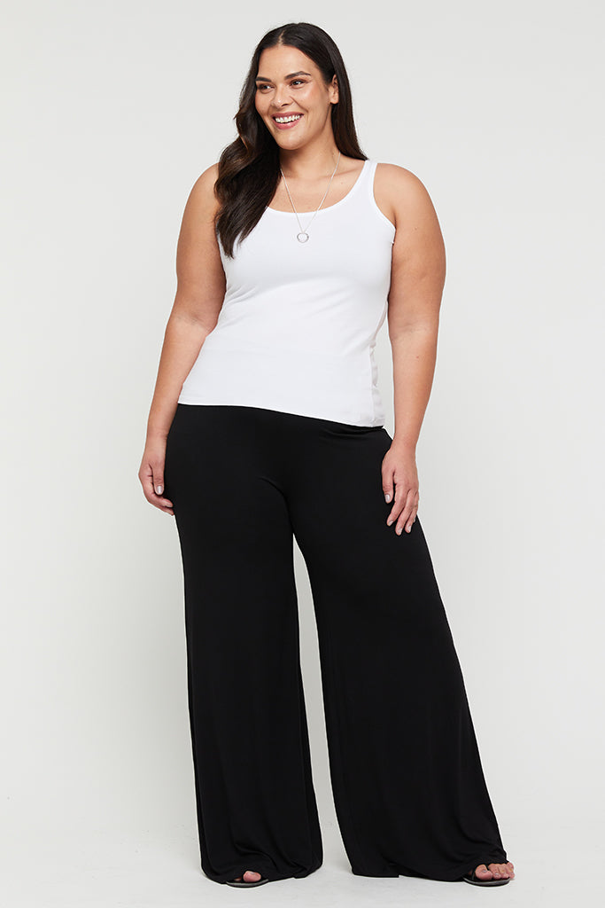 a plus size model wearing comfy bamboo pants with wide leg in black colour
