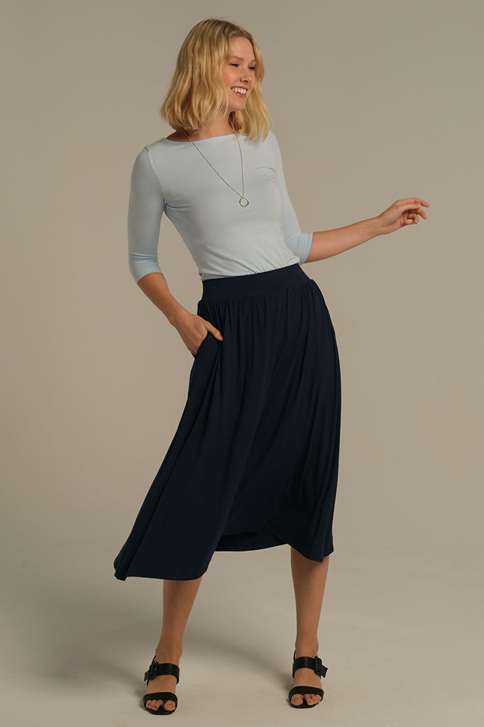 Dark navy bamboo midi skirt with side pockets, front view