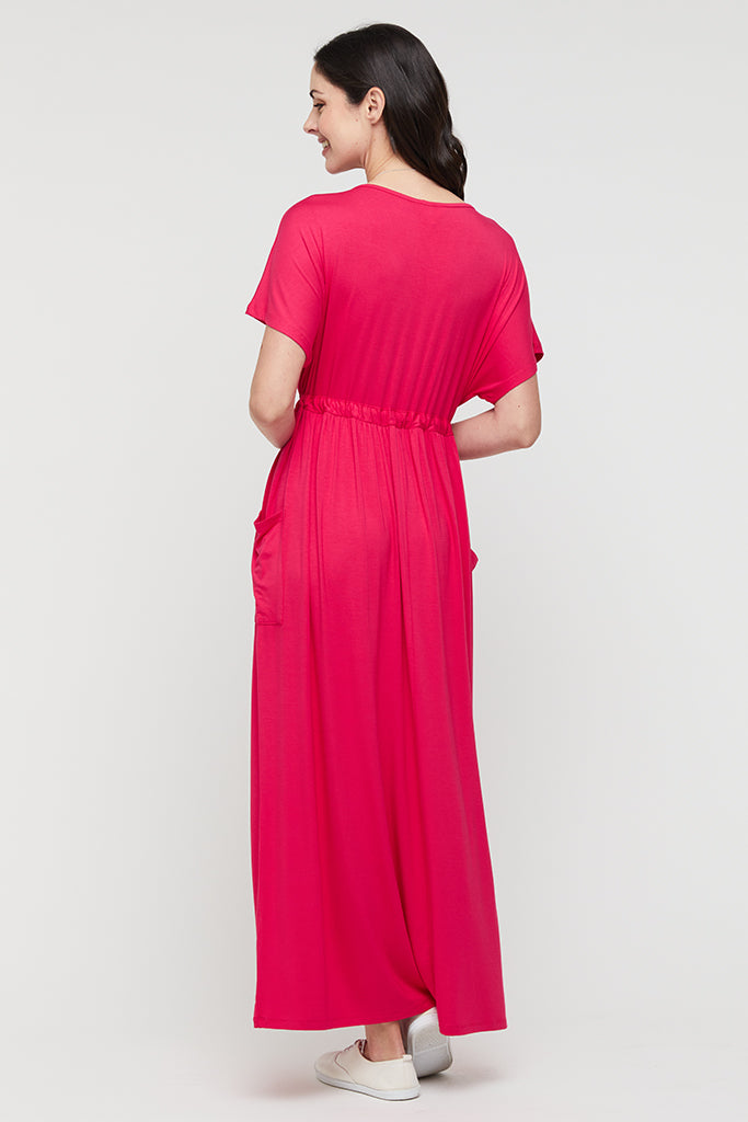 Back view of magenta midi dress with pleats.
