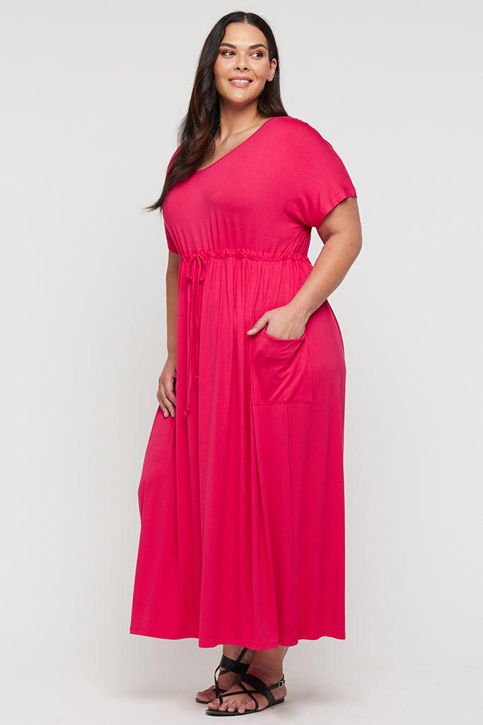 Plus size maxi dress with short sleeves in bright pink.