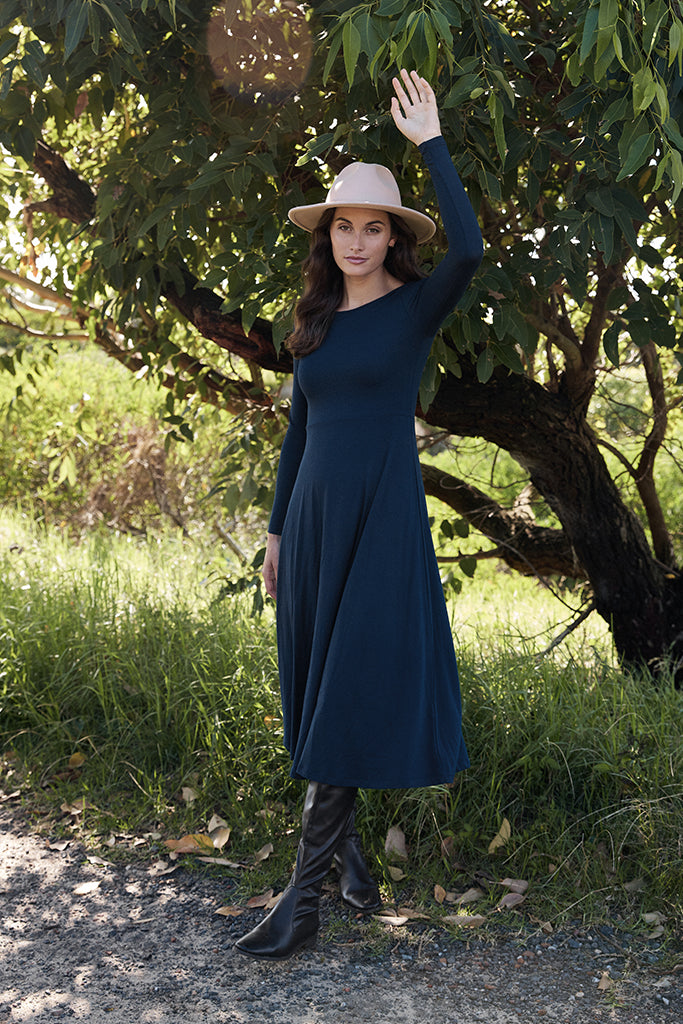 Classic navy winter dress, featuring round neckline and simple design.