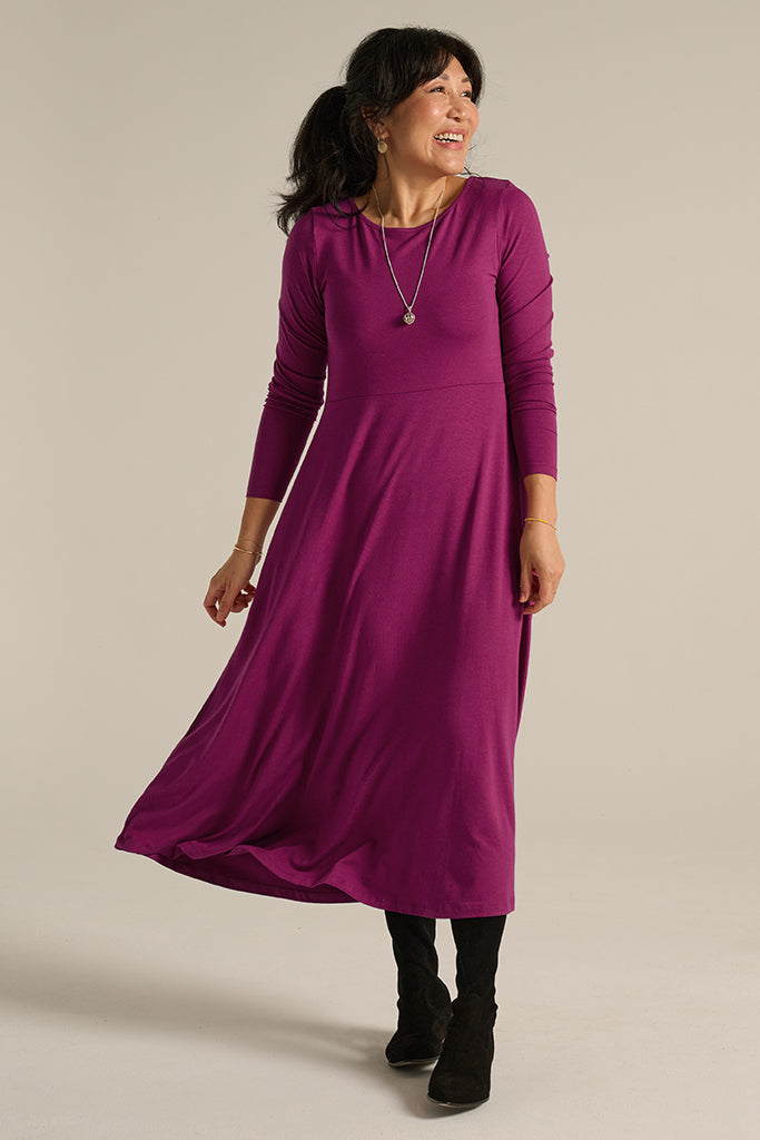 Warm winter dress with round neckline, full-length sleeves and flattering a-line silhouette.