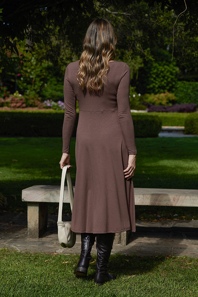 Brown ribbed winter dress with long sleeves and flared skirt.
