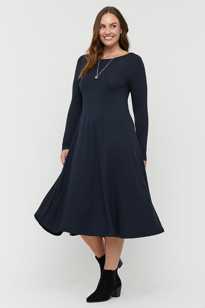 Warm and breathable long sleeve bamboo dress in navy, styled simply for a timeless look.