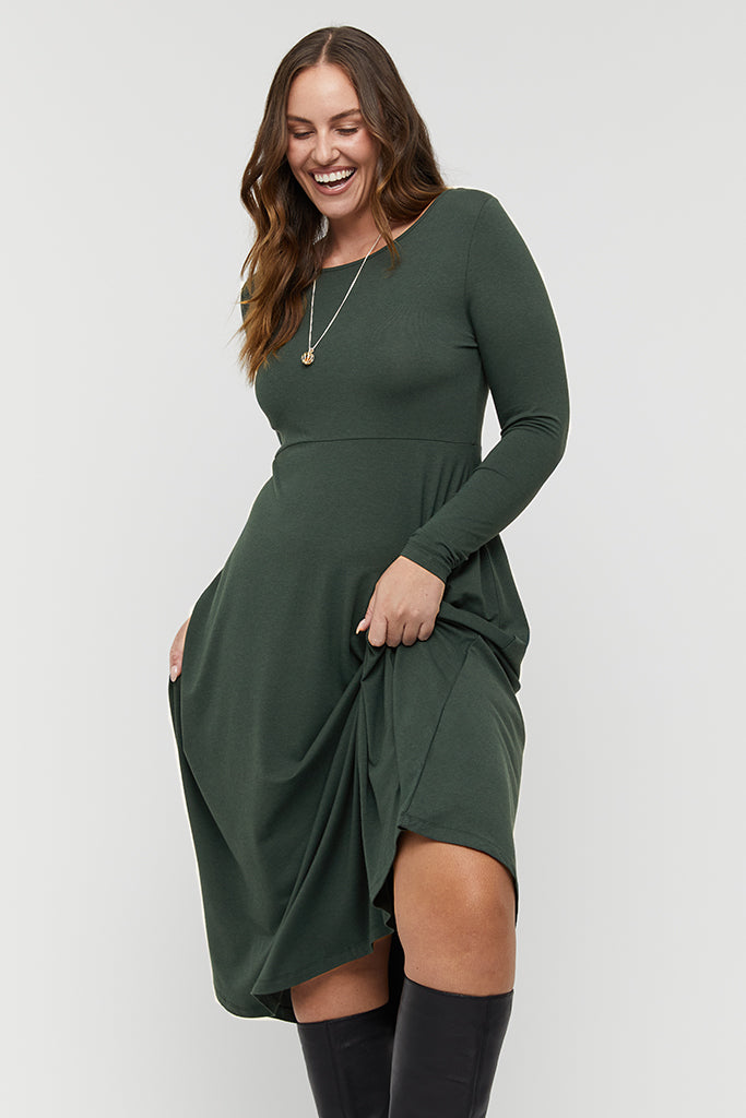 Casual green long sleeve midi dress styled simply for everyday ease.