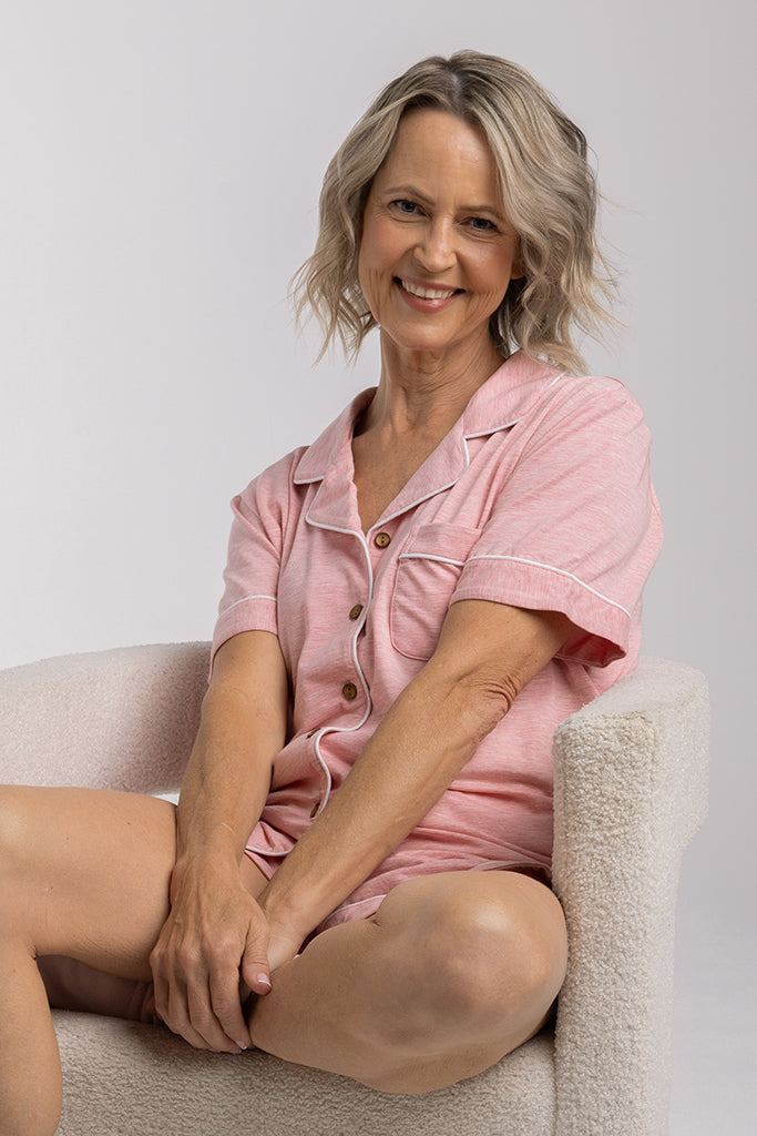 Close up of model sitting in a comfortable bamboo PJ set with relaxed posture.