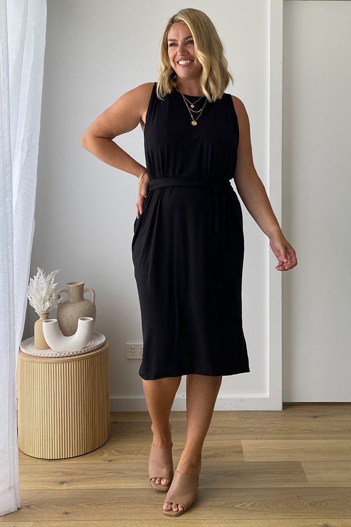 Black bamboo dress with high neckline and belt.