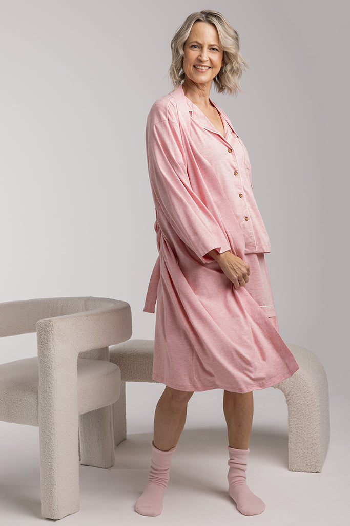 Model wearing a light pink sleepwear robe made out of bamboo - perfect for sensitive skin