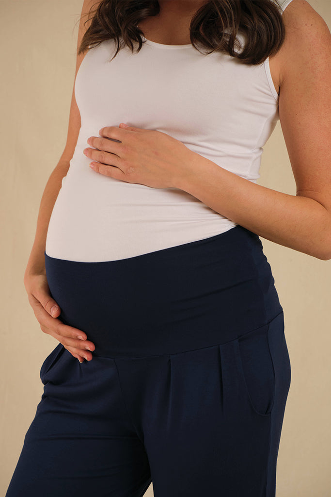 a close up view of the bump friendly slouch pants with a wide and stretchy fabric waistband