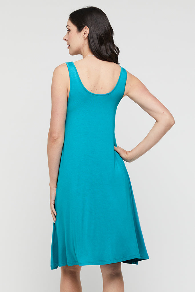 Back view of teal summer dress, featuring scooped back