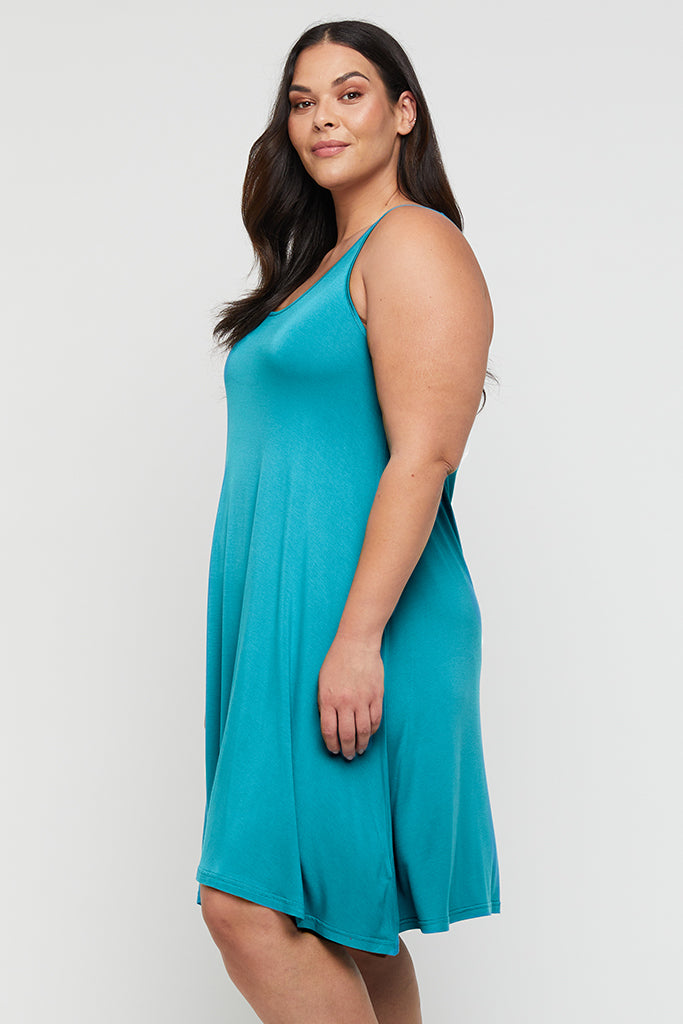 Side view of curvy bamboo dress featuring scoop neckline and no sleeves