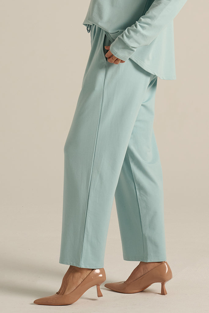side view of the aquamarine Voyager pants pants with side pockets