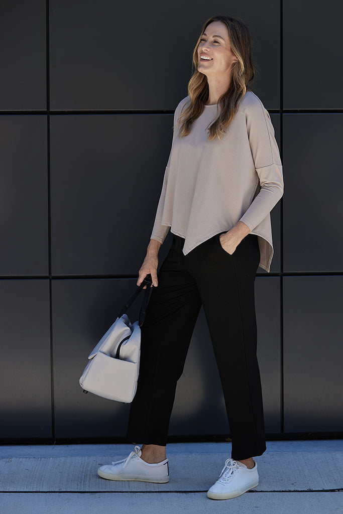 Cropped length black pants with slightly tapered leg and side pockets