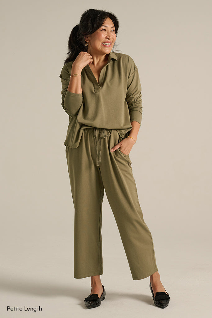 a model wearing soft bamboo pants in olive colour with drawstring and side pockets