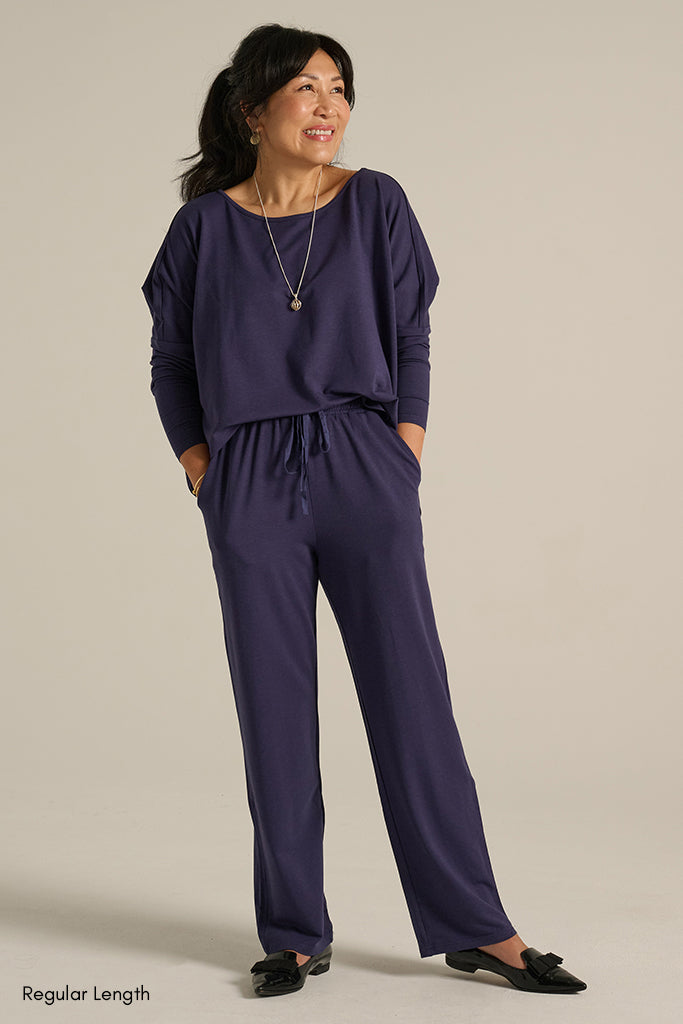 long indigo blue pants with side pockets and drawstrings on the waistband
