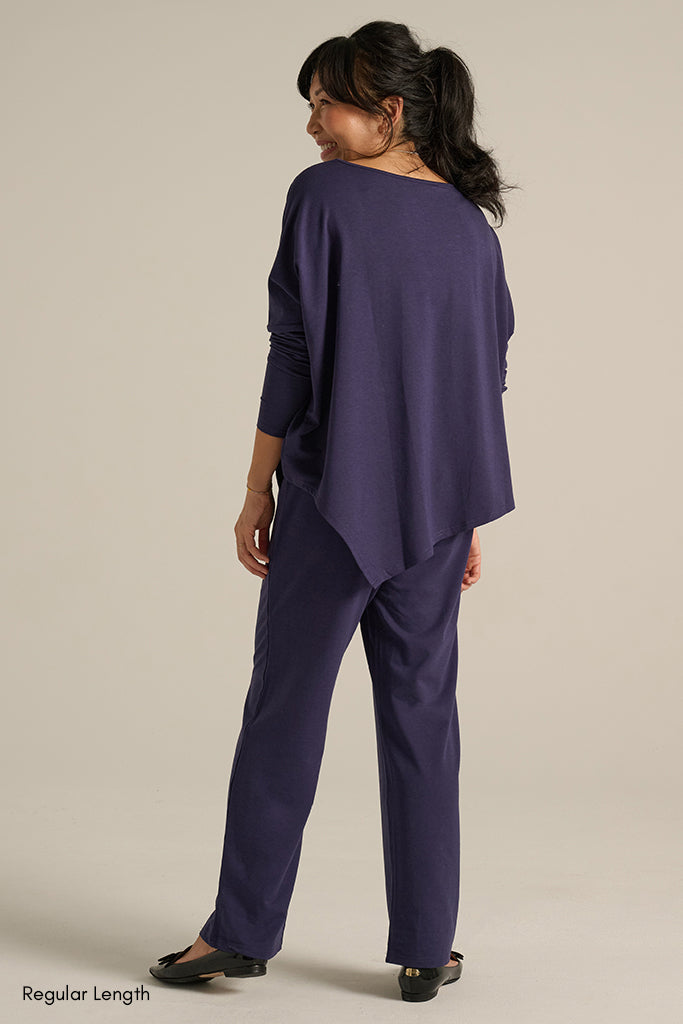 back view of the indigo outfit with asymmetric top and long pocket pants