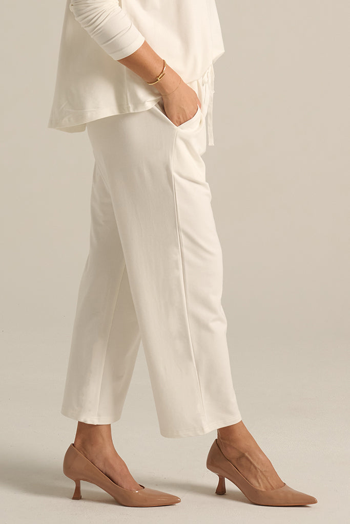 side view of the Voyager pants in soft white with side pockets