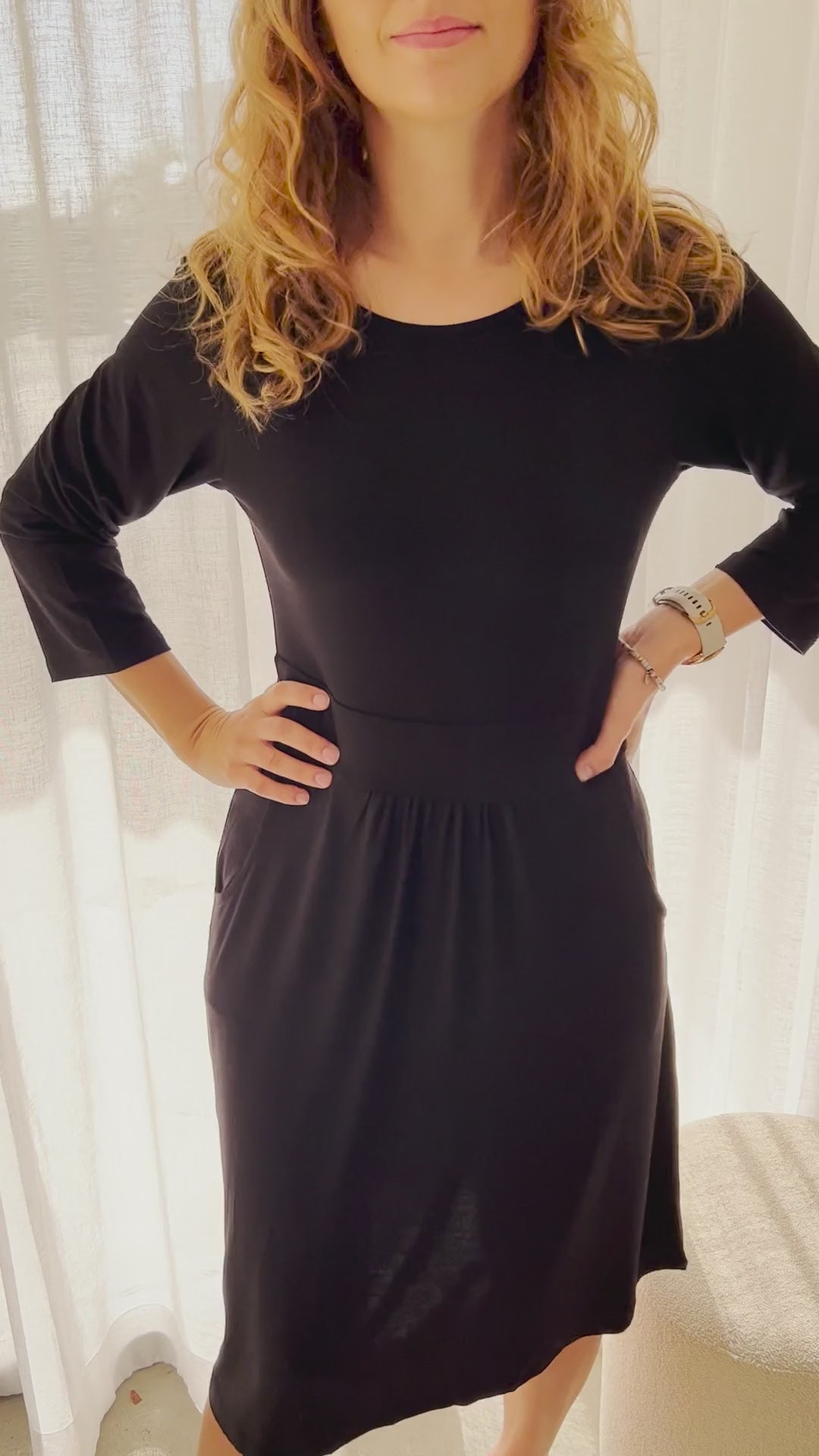 Video of 3/4 sleeve black bamboo dress with pockets