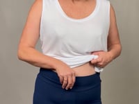 a model talking through the soft bamboo leggings in navy
