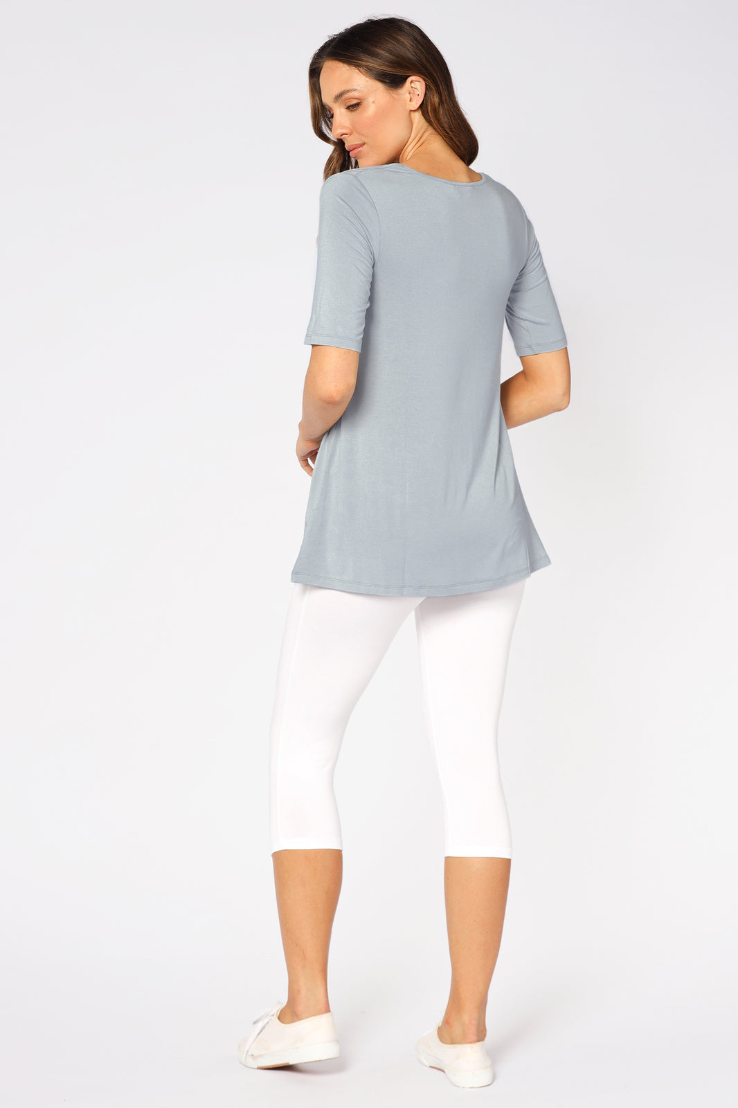 a back view of the white cropped leggings